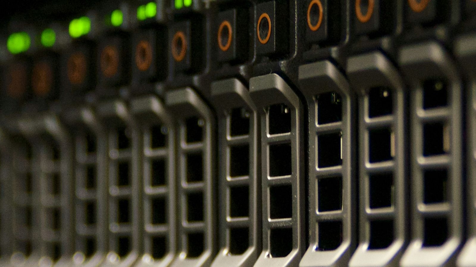 Row of storage-array drive bays with green and amber status lights
