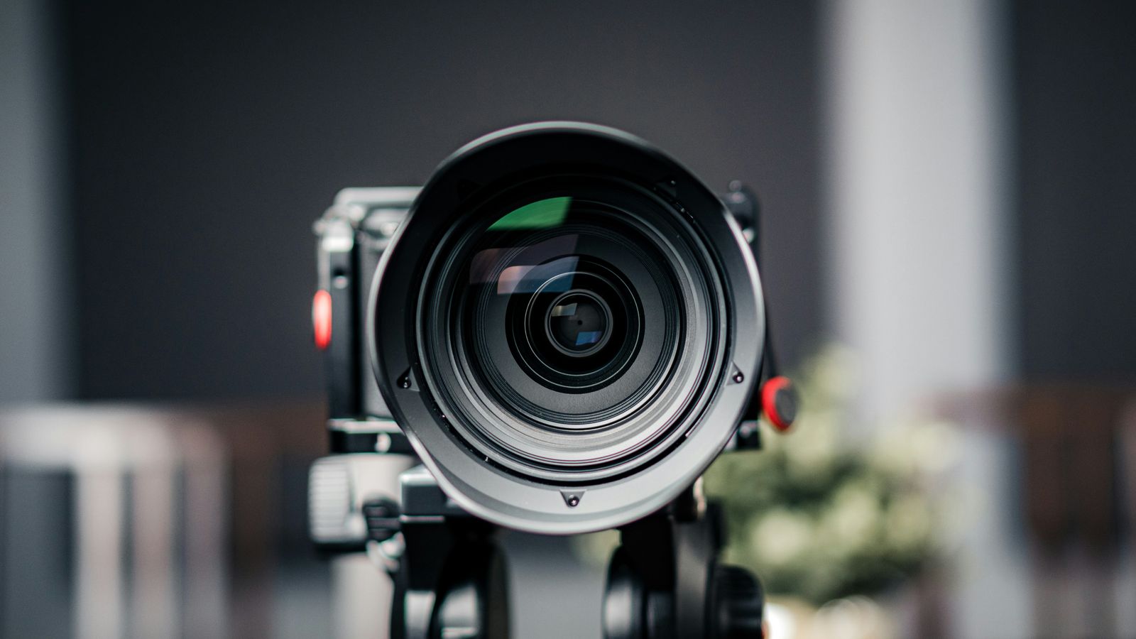 Front view of a video camera lens on a support rig