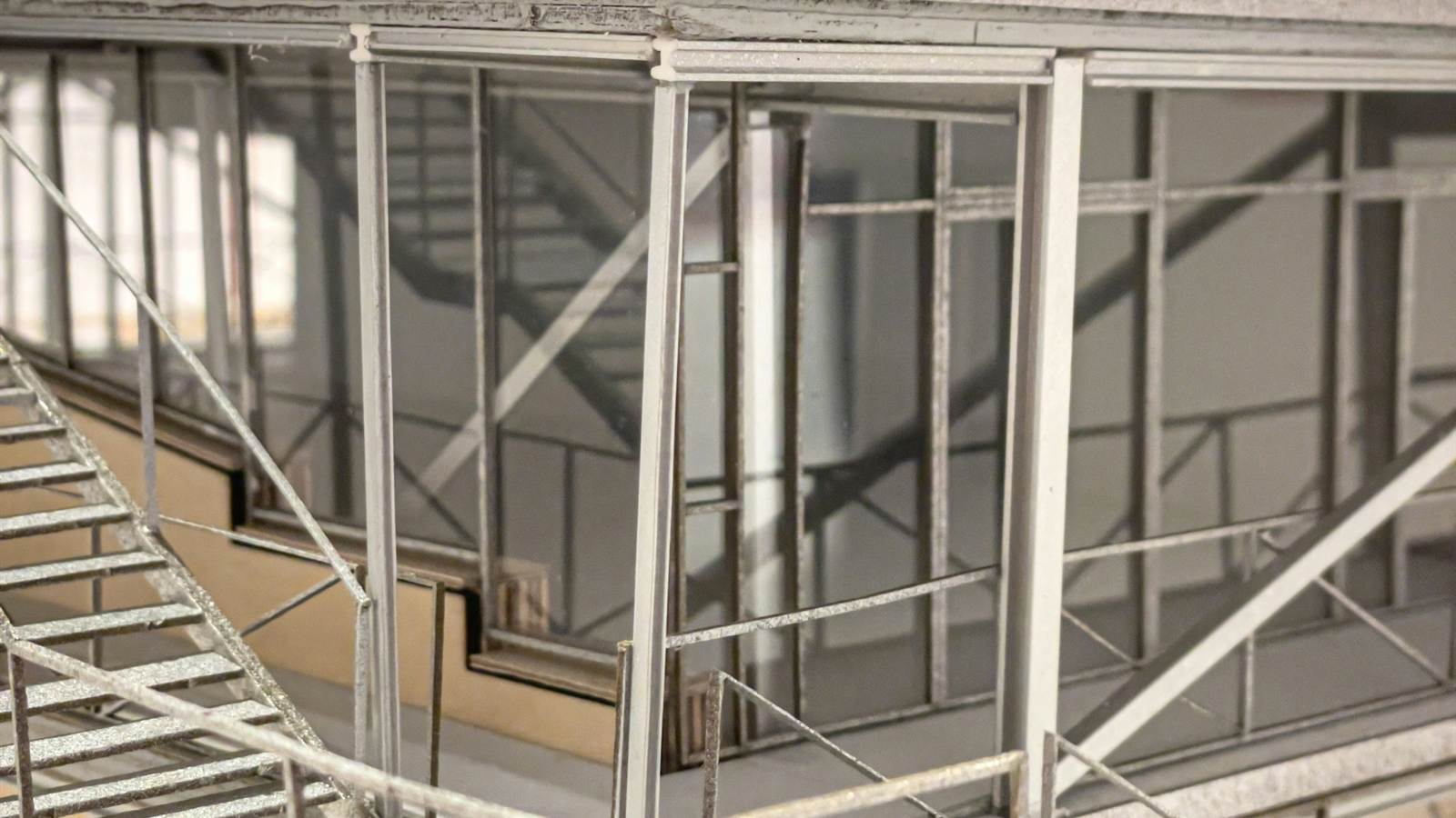 Architectural building model with metal stairs and structural framing