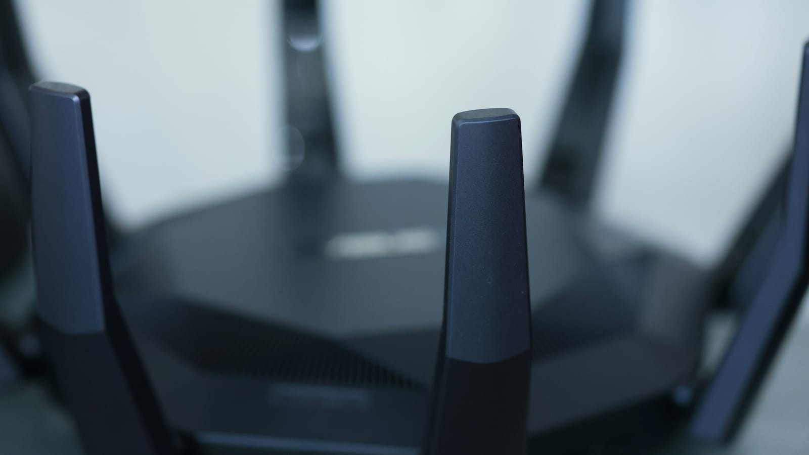 Close-up of a wireless router with upright antennas