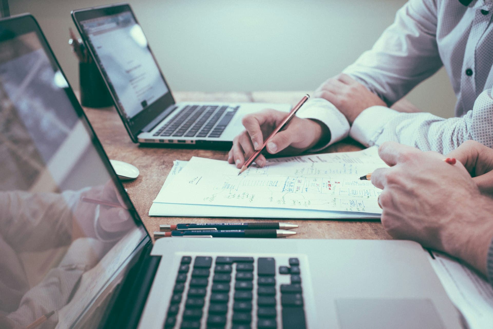 Professional working with laptop and documents