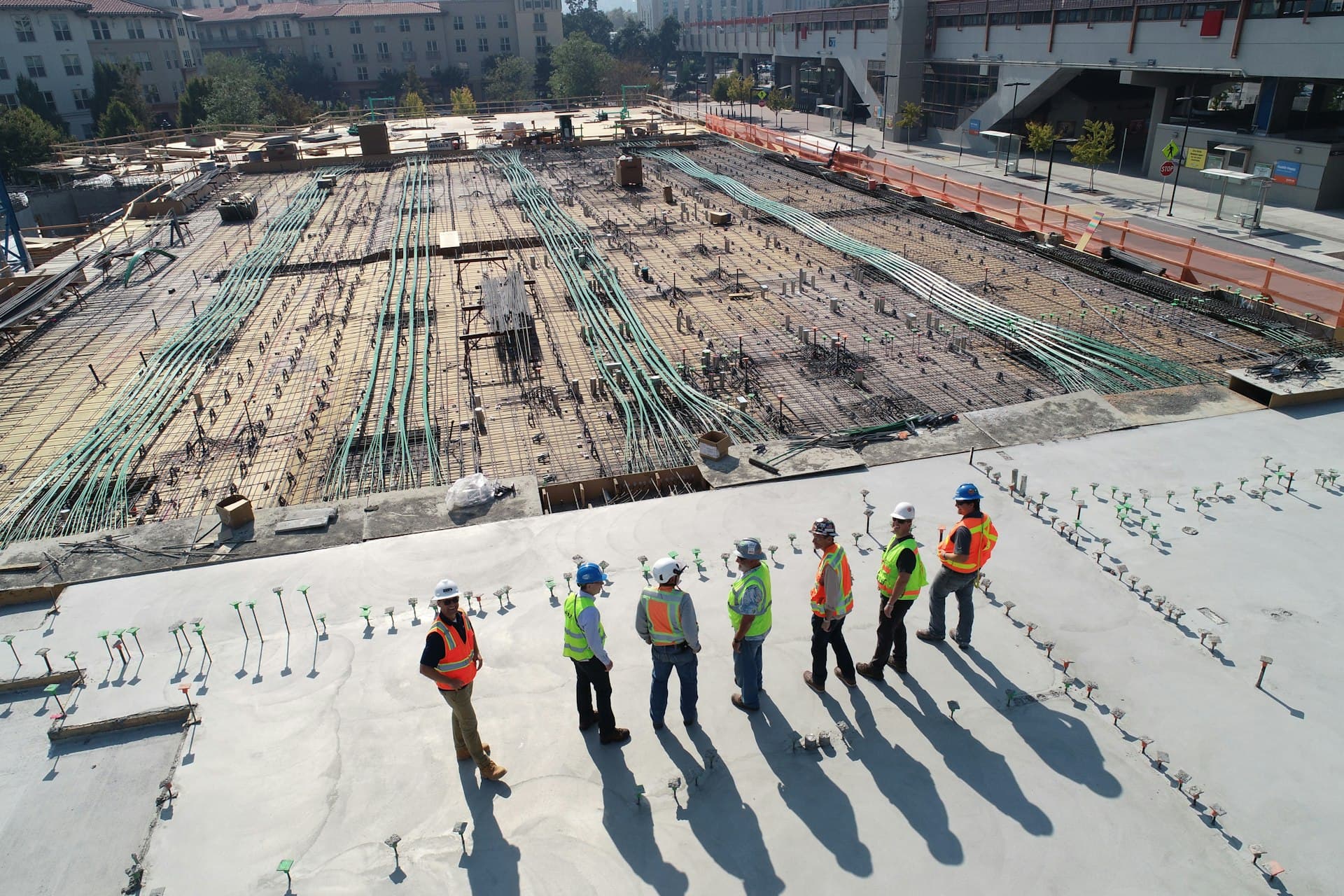 Active construction site with high-rise crane during daytime